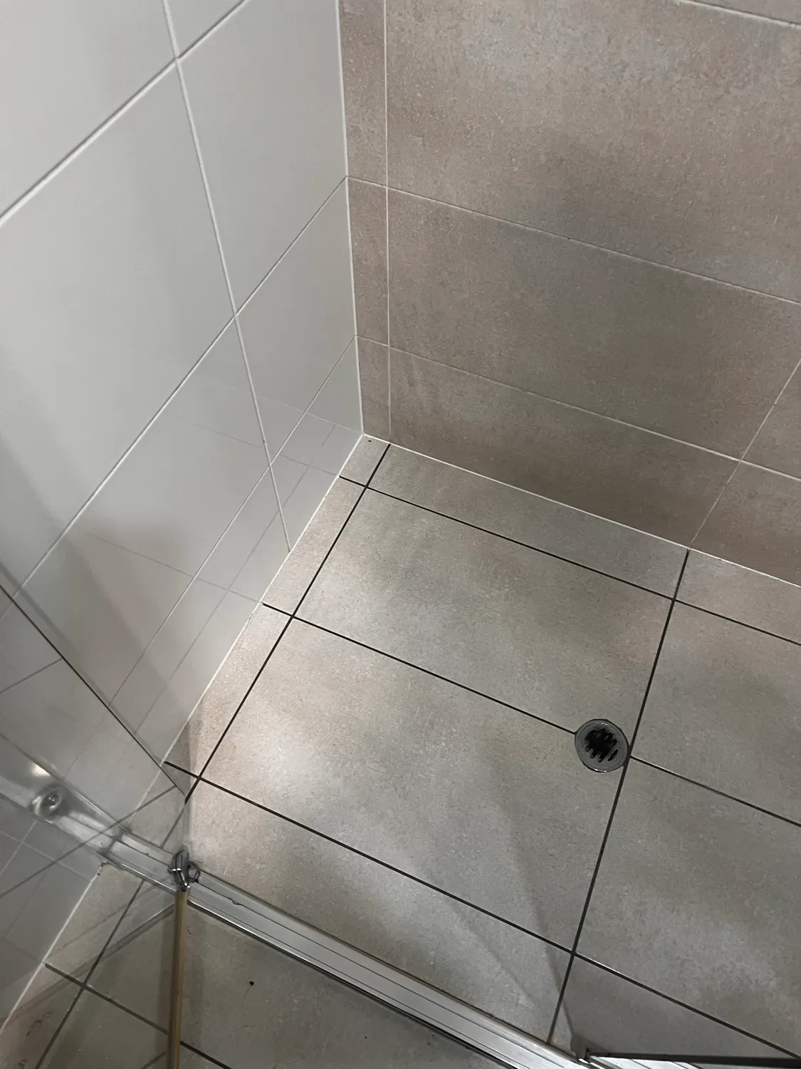 Shower glass with cleaning products after cleaning