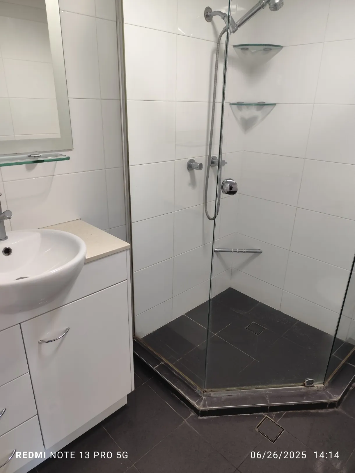 Corner shower screen with grime after cleaning