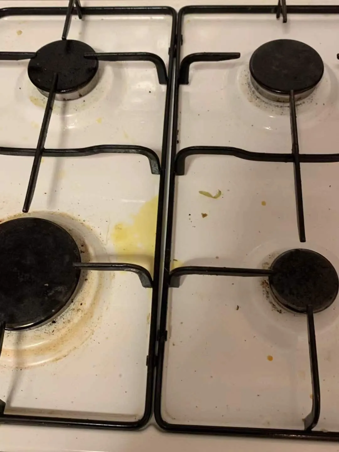 Gas cooktop black before cleaning